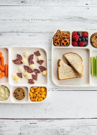 Nordic Ware divided meal trays with kids meals sandwiches fruits and snacks in separate compartments